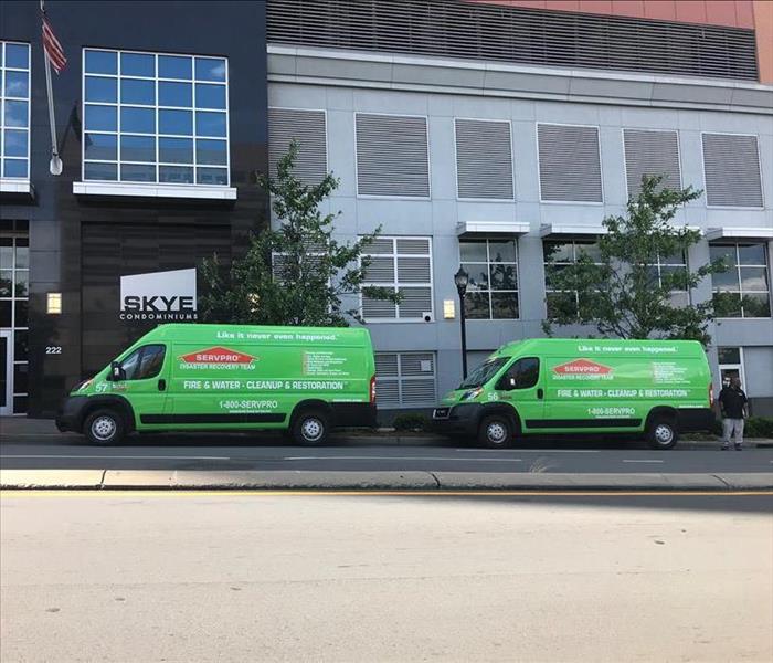 Two Servpro Dodge Promaster Vans out front of a commerical building Skye Condominiums in Charlotte, NC.